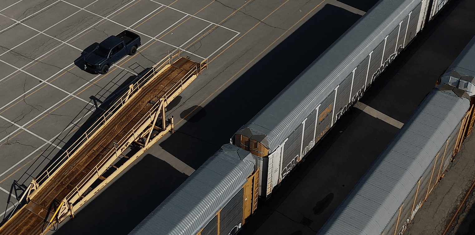 Aerial view of the vehicle loading ramp and enclosed autorack rail cars at the CN terminal in Vaughan, Ontario